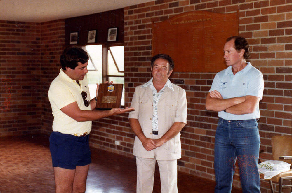 Bill Haigh being presented with a plaque