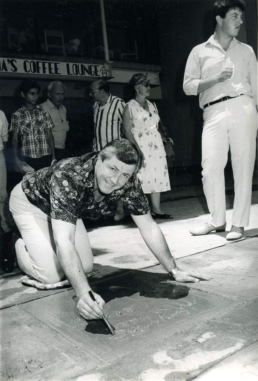 Michael Cleary signing his name at Sydney's Pier One