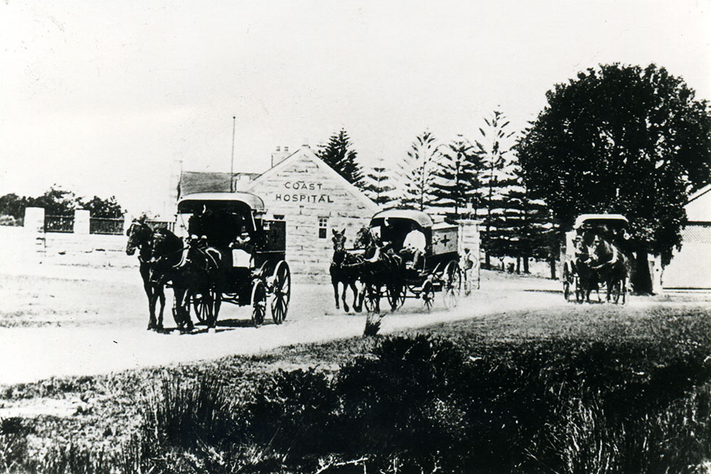 The Coast Hospital entrance with horse drawn ambulances
