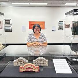 Aunty Maxine Ryan with the Sydney Harbour Bridge Shell Art
