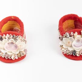 Pair of red velvet shellwork baby shoes