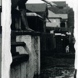 Child diving into floodwaters at Cooper Street