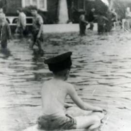 Child in flooded street