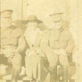 Soldier and family smiles towards the camera
