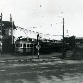 Tram in Belmore Road, Randwick next to the Captain Cook statue