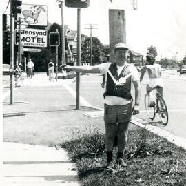 Man at the corner of Alison Road and Doncaster Avenue, Randwick