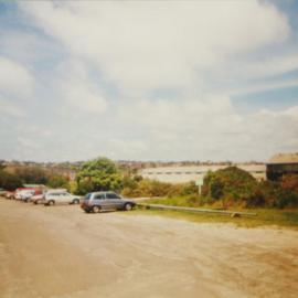 Section of the Randwick Barracks with a cars parked