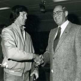 Tony McDonald accepting the Athlete of the Year award from Ken Morris, Industrial Relations Officer