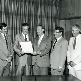 Mike Cleary with with stakeholders of the 1984 Statewide Caltex Country Rugby League