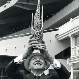 Horsetrainer T. J. Smith with trophy
