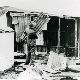 Man building a shanty at Happy Valley