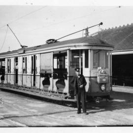 Conductor in front of tram at Maroubra Beach Terminus
