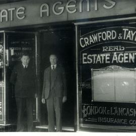 Crawford and Taylor outside their real estate agency