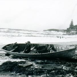 A child in a fishing boat on Coogee Beach